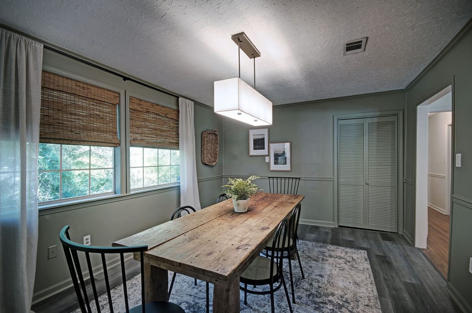 The beautiful dining table and six chairs in the dining room. 