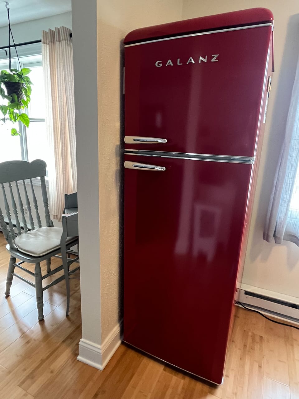We adore this antique fridge. A little something extra you don't see every day.