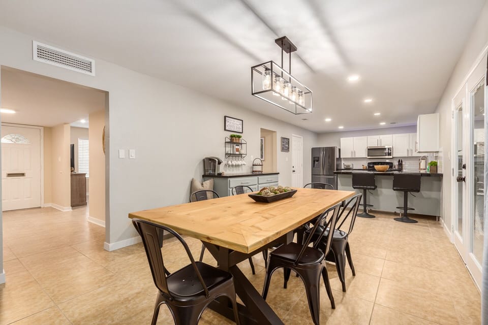Dining table and additional kitchen bar stools.
