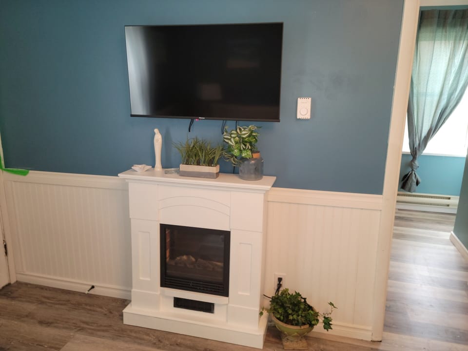 Smart tv with Bell MTS and wifi. Electric fireplace.