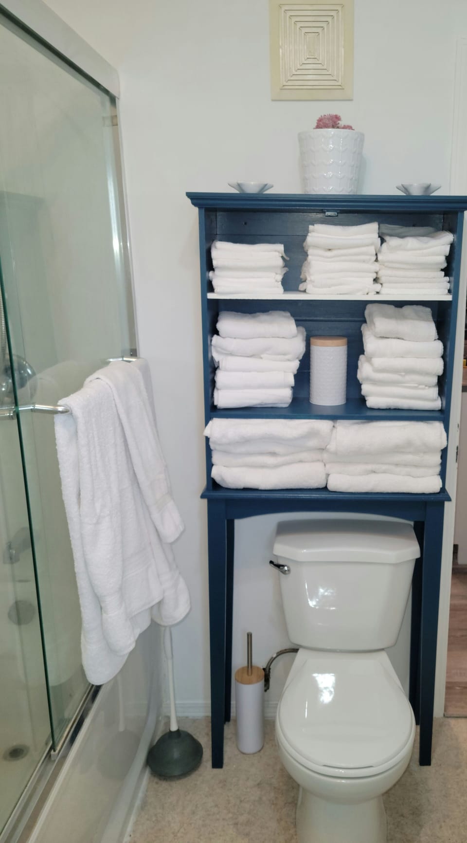 Bathroom with linens provided. Stackable washer/dryer for your use. Jetted tub.