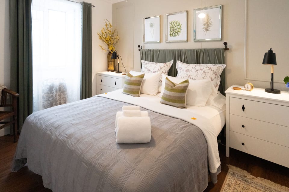 Second bedroom featuring king Size bed & plush linens & pillows.