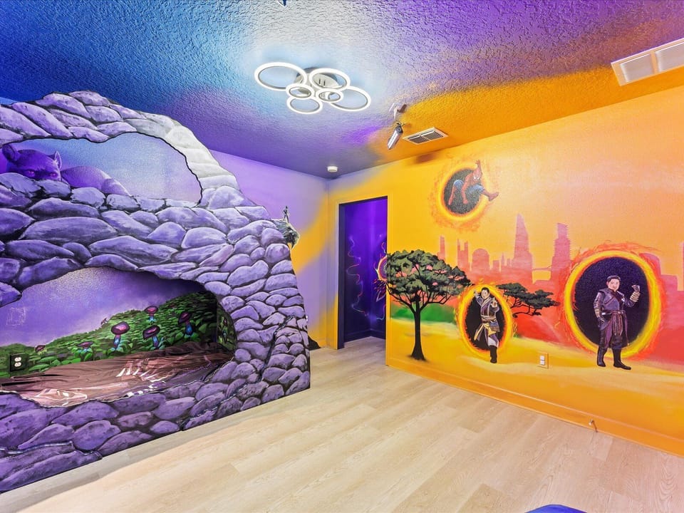 Black Panther Room with custom bunk bed, 43" TV, and murals of Avengers.
