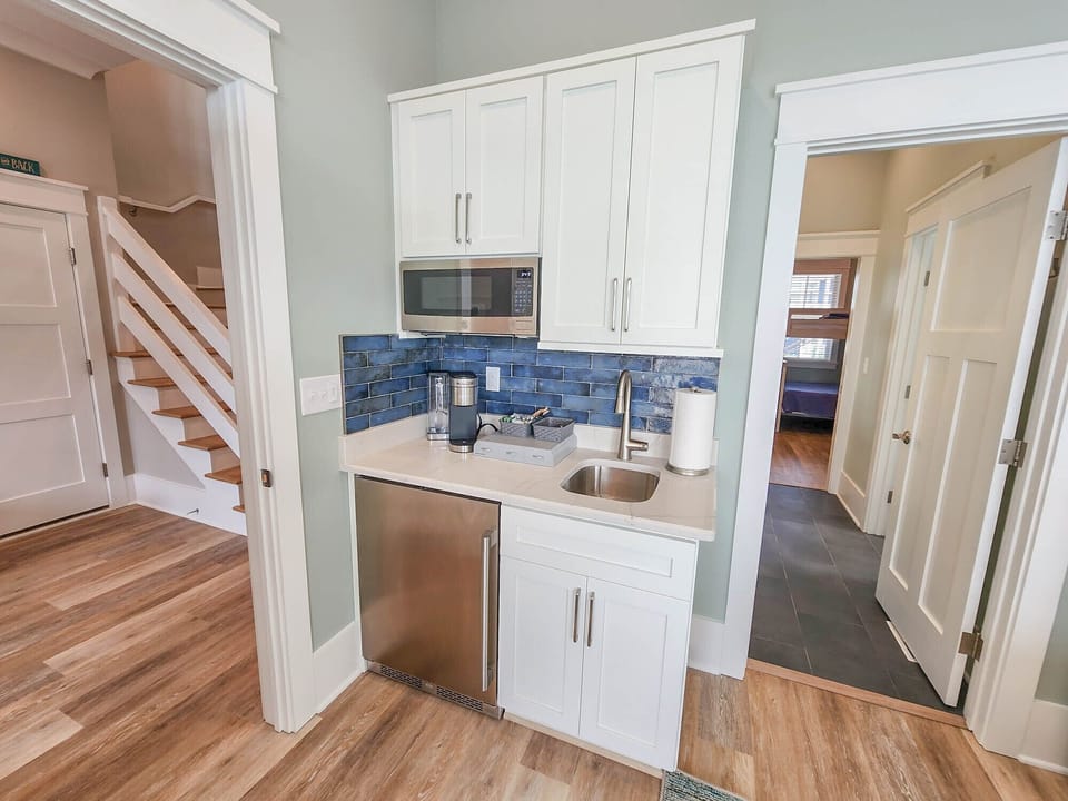 The first floor bedroom is furnished with is own mini kitchen, convenience at it's finest!