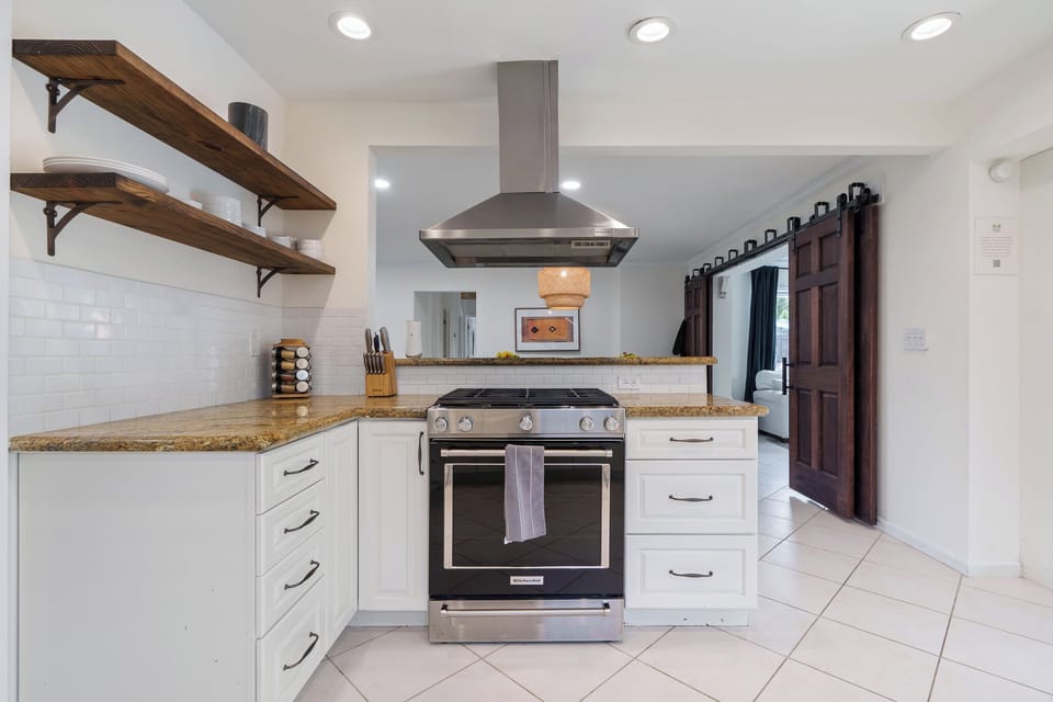 Cook in this stainless steel kitchen w/ /5-burner gas stove, coffee bar & more!