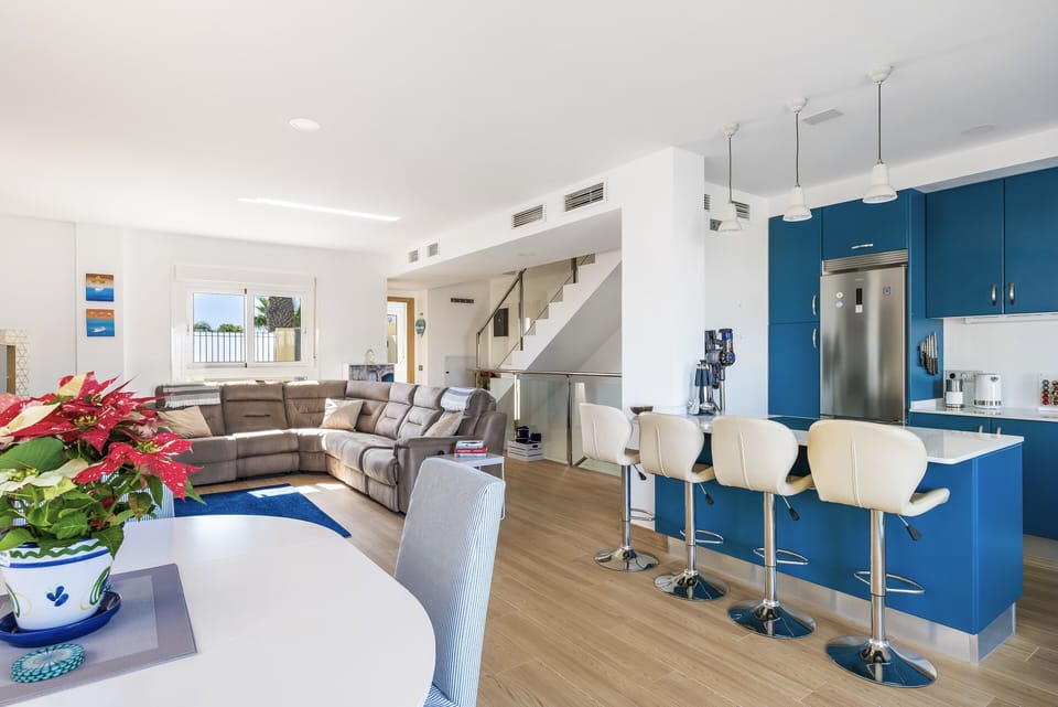 View from rear patio doors into kitchen and lounge.