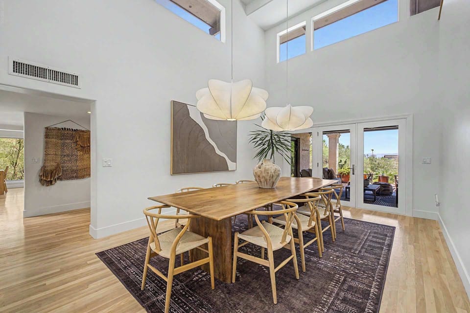 Party of 10! This solid wood dining table has room to host fabulous dinner parties with views of the canyon as your backdrop