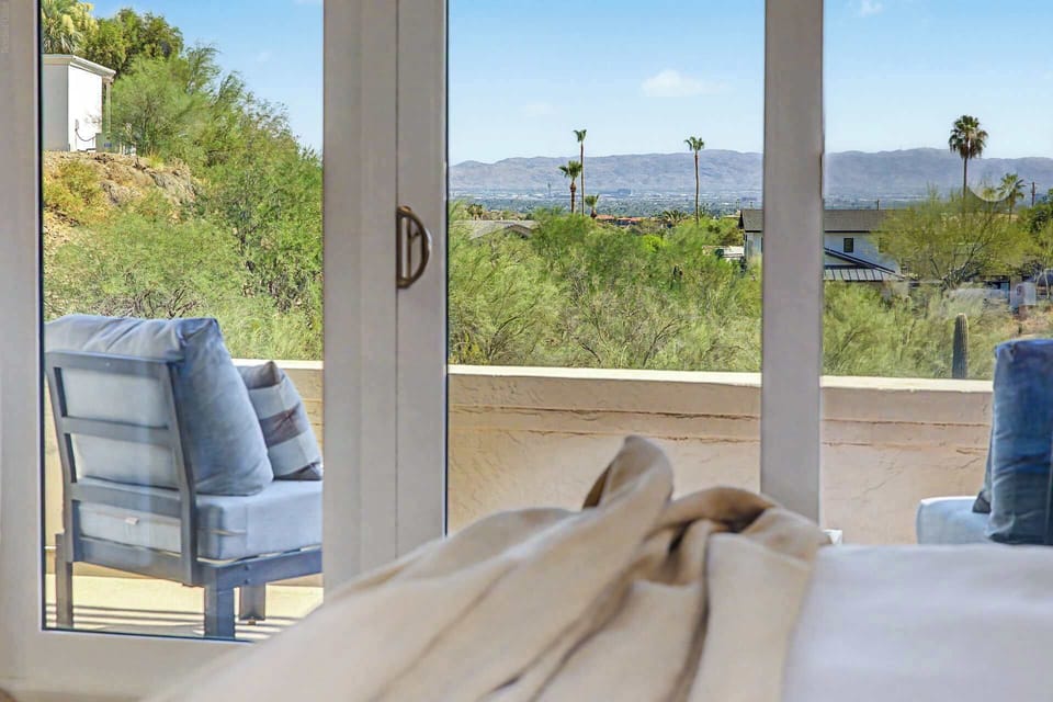 View terrace off upper-level primary bedroom with view to the city, PHX sky harbor airport and South Mountain park.