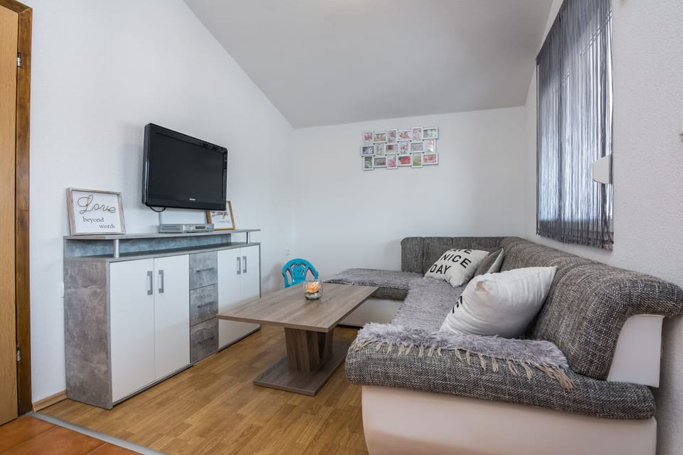 Family Apartment A1 | Living area | 100-cm flat-screen TV with satellite channels, TV