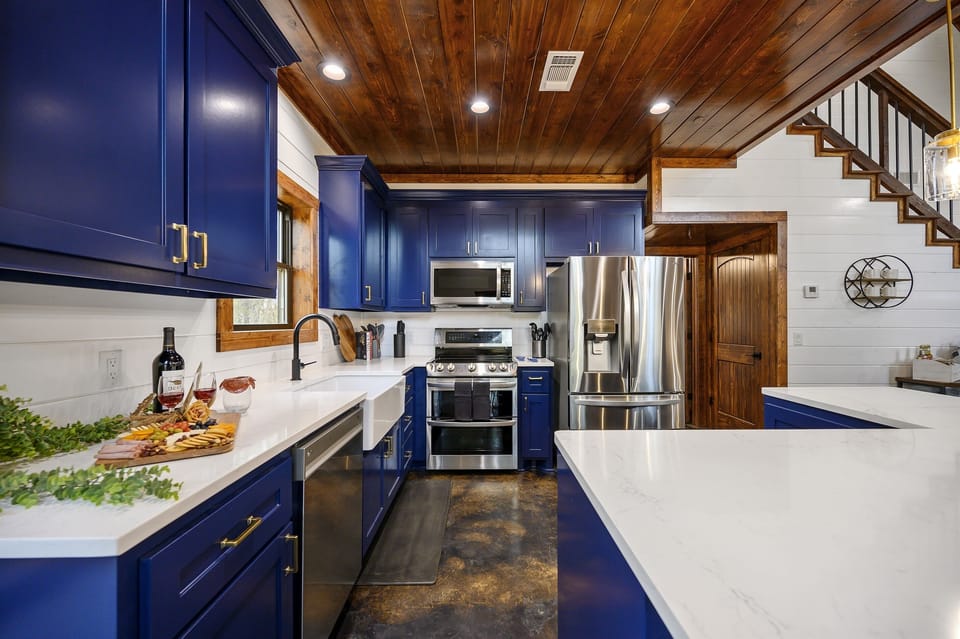 Prepare family meals with ease using double ovens, modern appliances, and a fully stocked kitchen.
