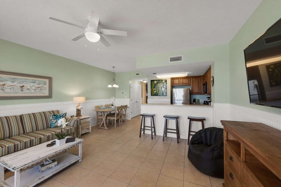 Open living area with a modern kitchen and casual dining space
