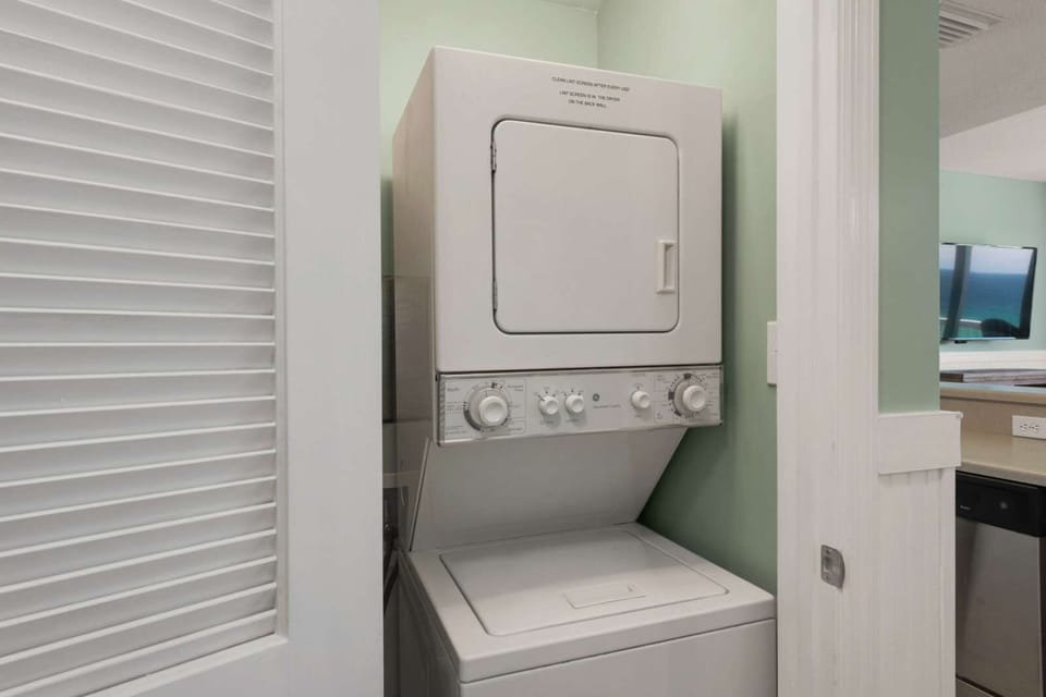 Stacked washer and dryer unit in a compact laundry space