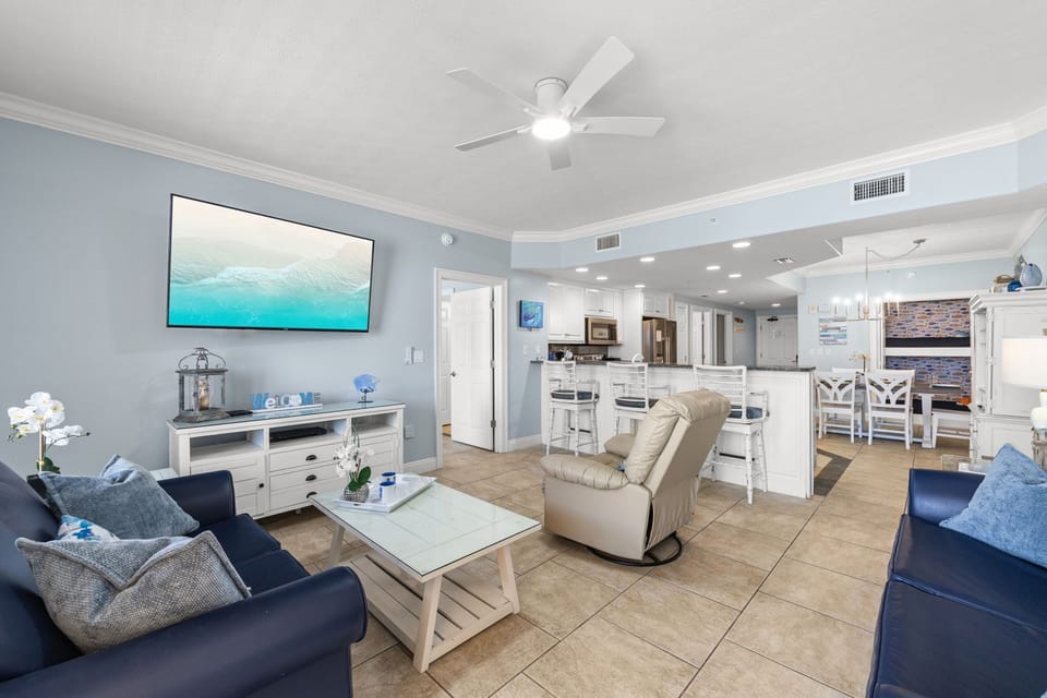 Open-concept living area with modern furnishings and a fully equipped kitchen.