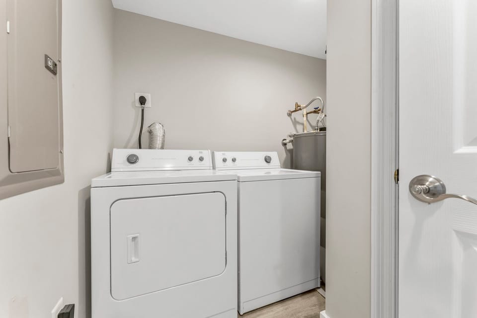 Laundry area with washer and dryer in a clean, functional space