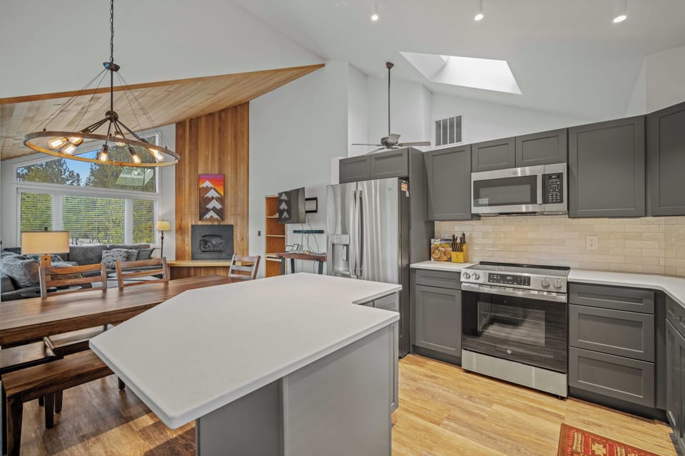 Your dream kitchen awaits with sleek granite counters, stainless appliances, and warm wood accents creating the perfect cooking sanctuary.