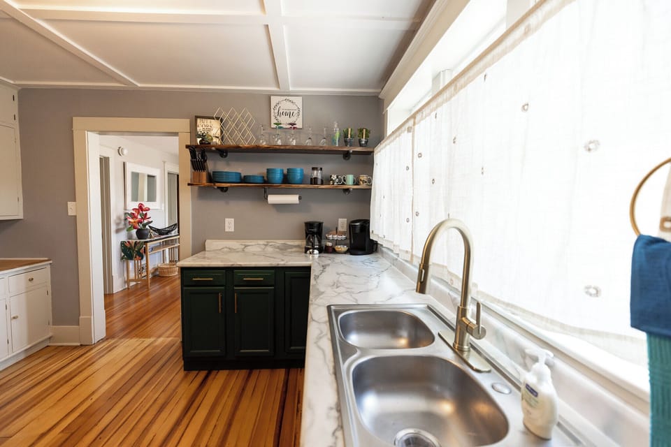 Your everyday dishes are easily accessible from the live edge open shelving.