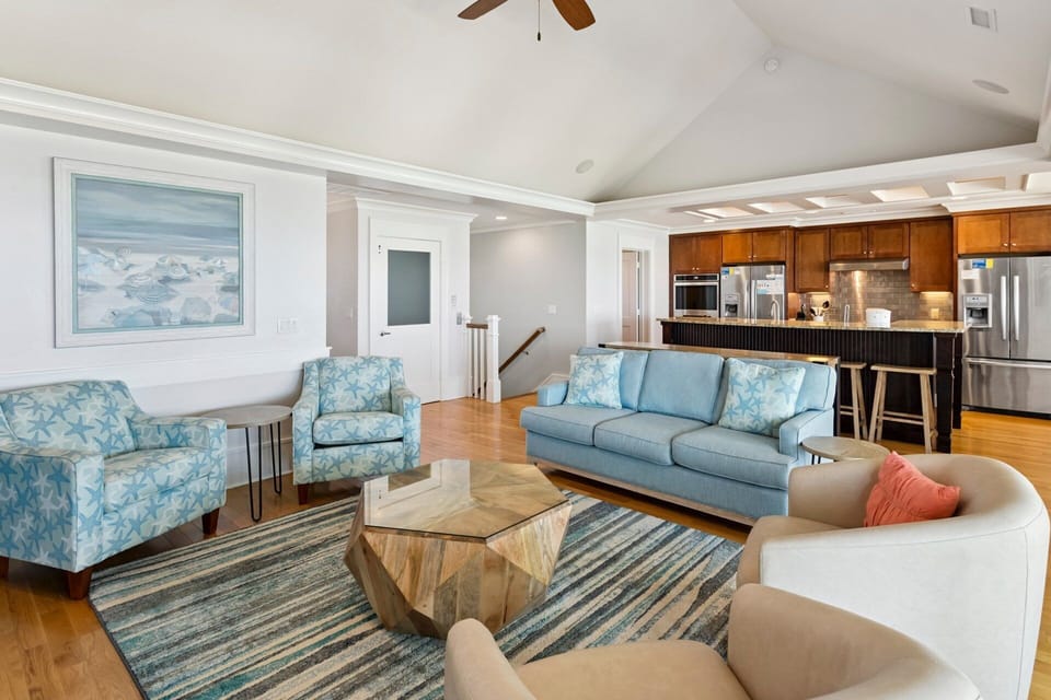 The top-level living area showcases breathtaking ocean views and updated furnishings.