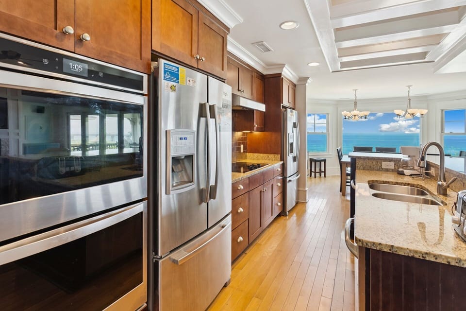The Open-Concept Kitchen with all modern appliances, a double sink, and 2 dishwashers is perfect for preparing an impressive gourmet meal for your entire family to enjoy.