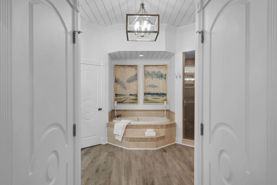 Huge spa-like masterbath with jacuzzi tub, separate shower, double vanity.