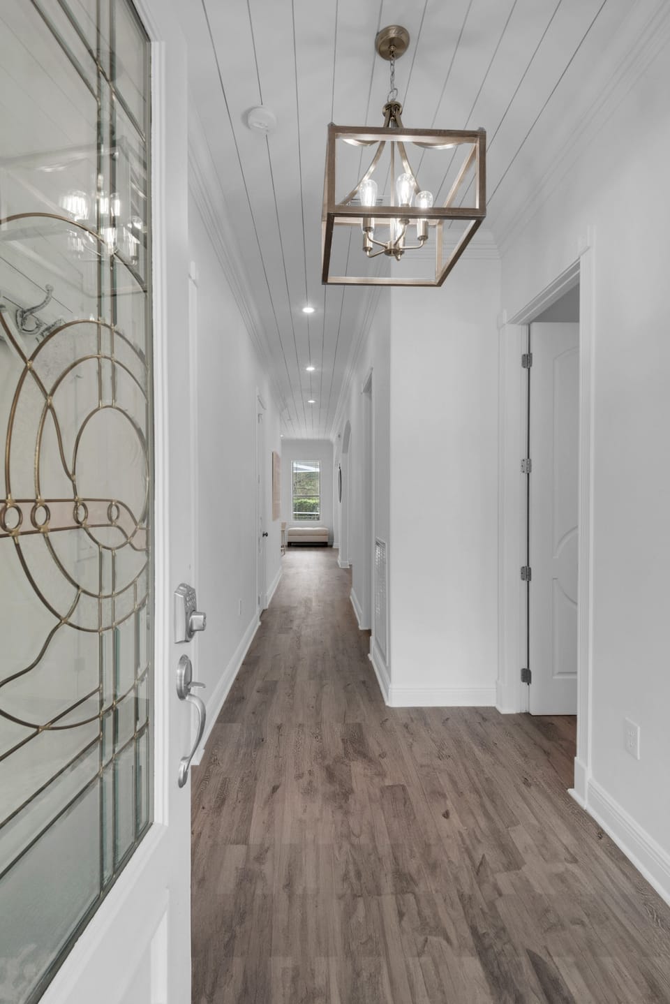 Hand cut shiplap ceilings and driftwood colored floors create a vintage feel.