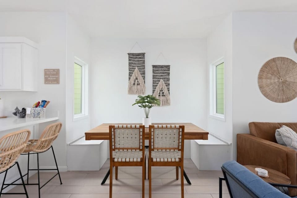 Bask in the stylish ambiance of chic wall decor and windows, allowing an abundance of sunlight to fill the space.