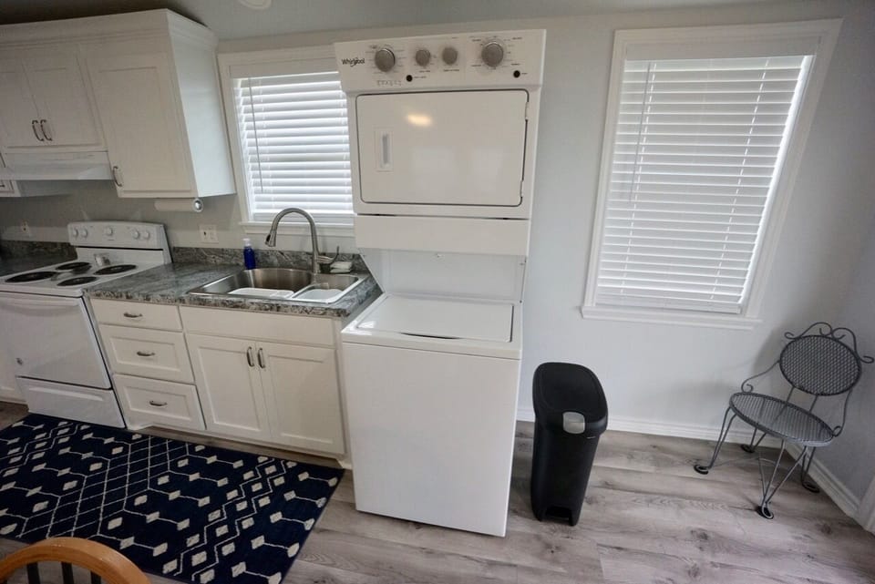 Stackable washer and dryer conveniently located