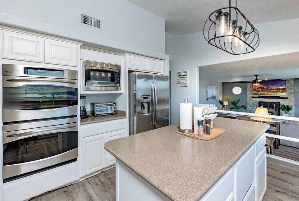kitchen with ample counter space and double ovens.
