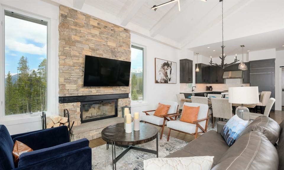 Wood burning fireplace and Smart TV in main floor living room