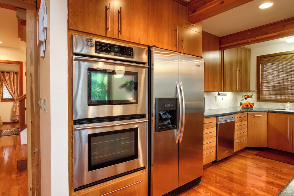 Chef’s kitchen with ample counter space and double ovens.