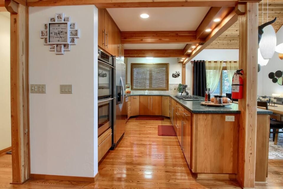 Chef’s kitchen with ample counter space and double ovens.