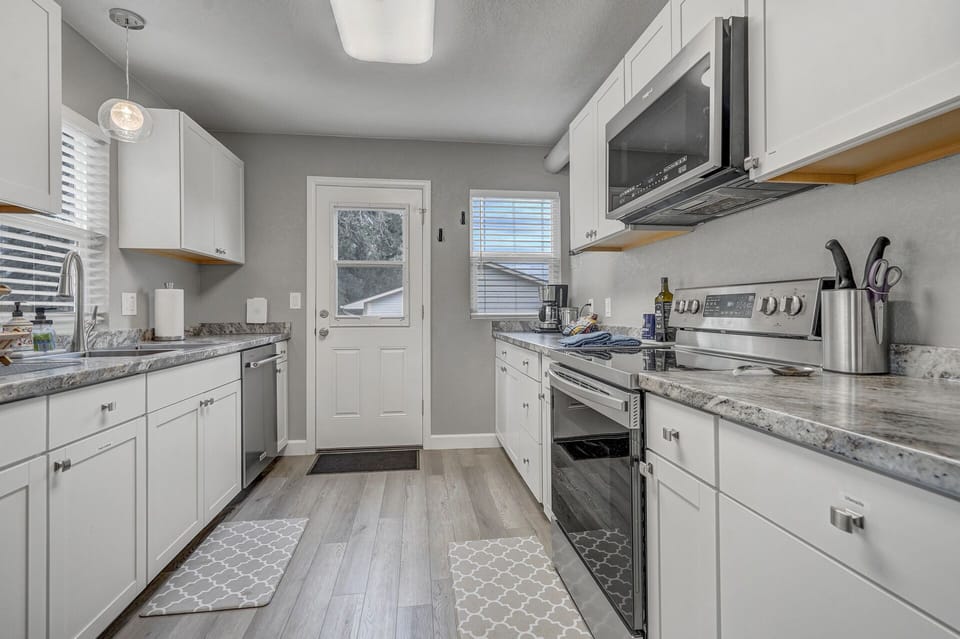 Gorgeous galley kitchen stocked with all your cooking needs!