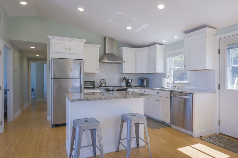 Beautiful updated kitchen with stainless steal appliances and kitchen island that seats two.