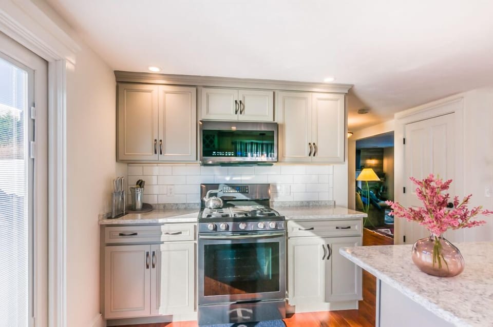 Updated Kitchen with stainless appliances and granite countertops.