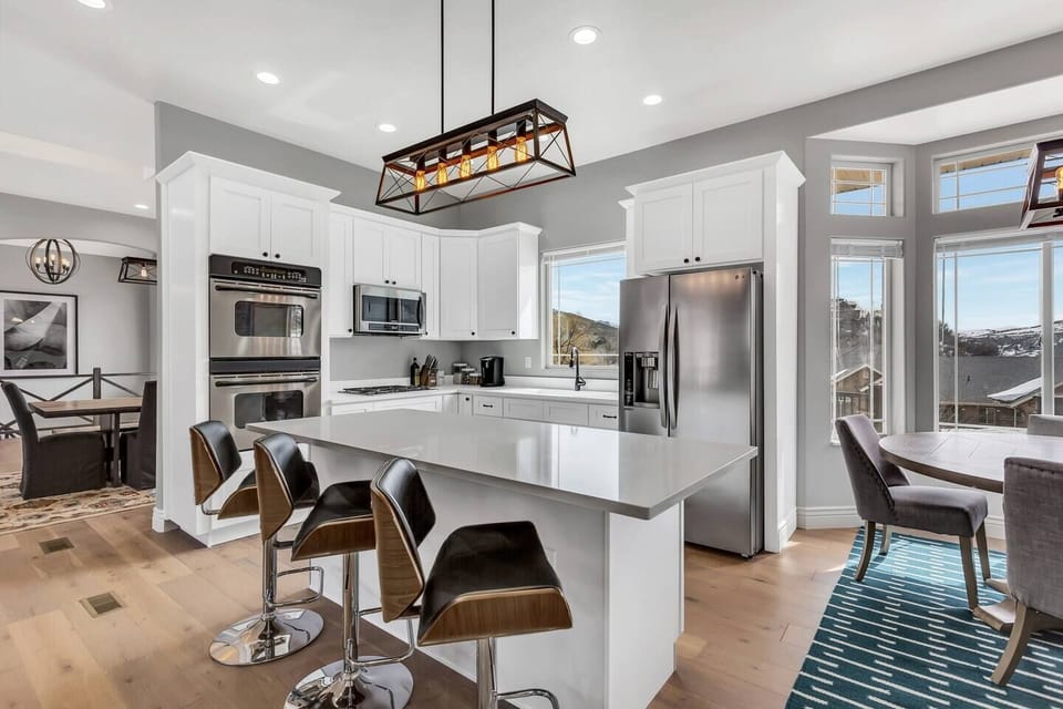 Sleek gourmet kitchen perfect for gathering and entertaining