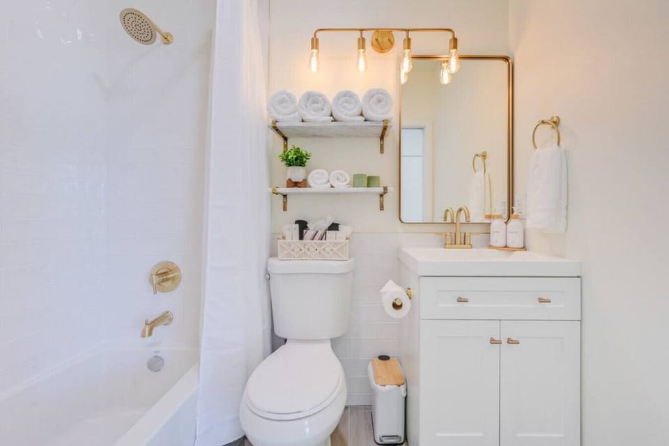 The inviting bathroom is separated from the main space by a pocket door.