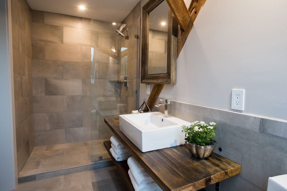 Shower, rainfall showerhead, designer toiletries, hair dryer