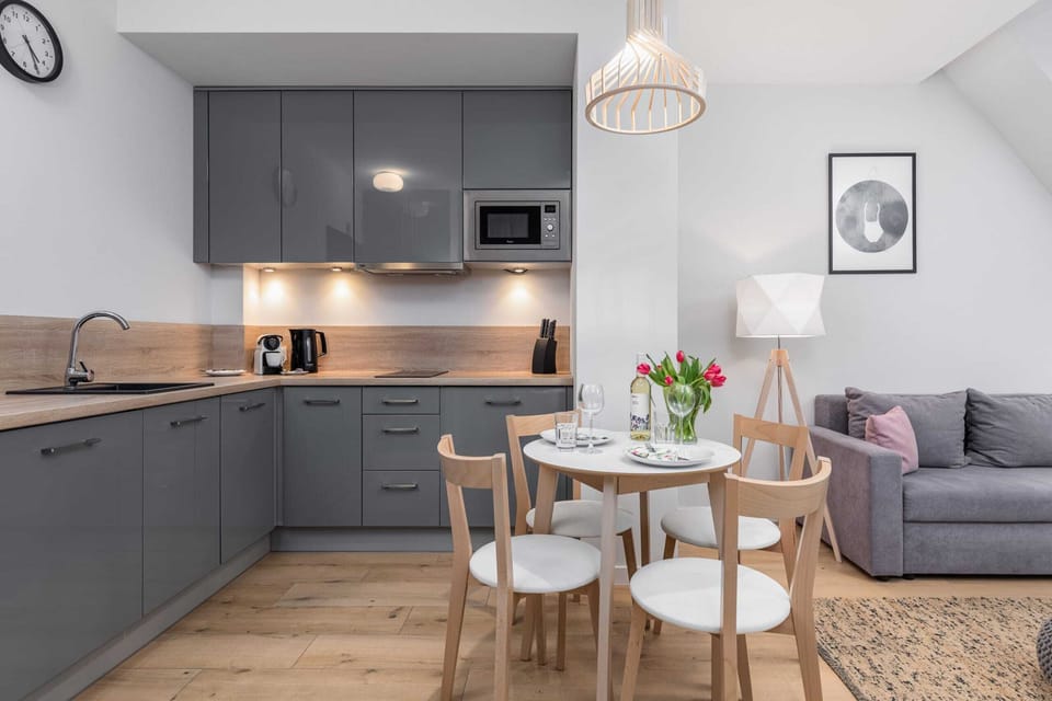Kitchenette with dishwasher.