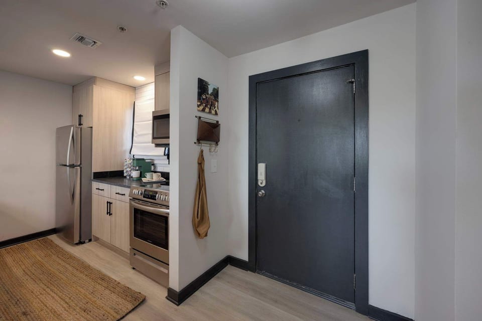 Sleek appliances and modern decor await your culinary adventures!