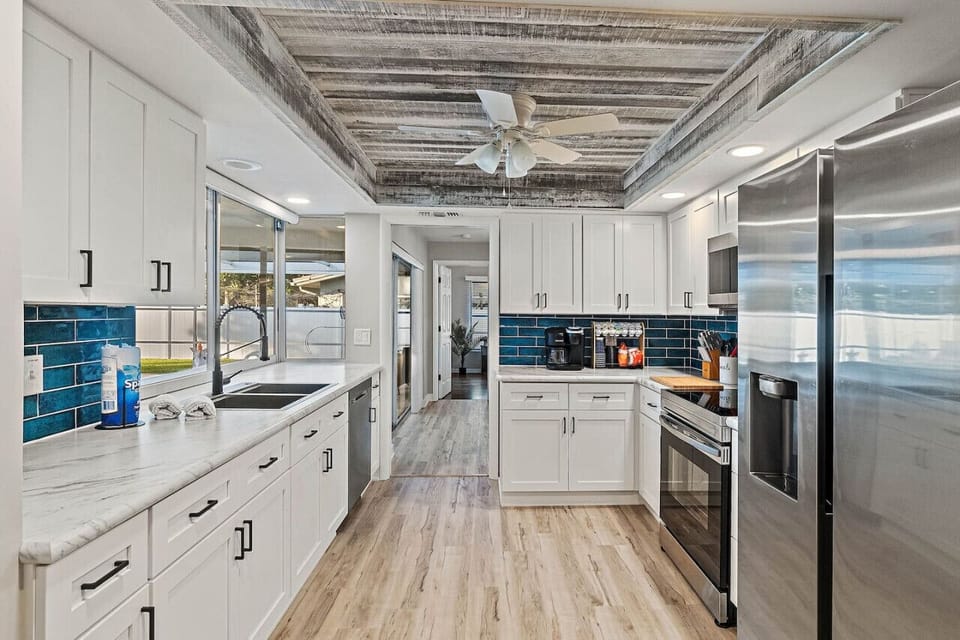 Completely renovated kitchen with coffee bar will kick-start your day.
