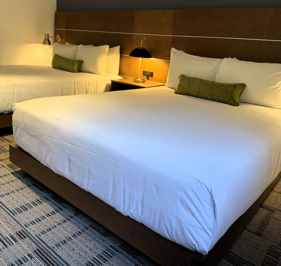 Premium bedding, desk, laptop workspace, iron/ironing board