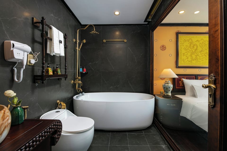 Combined shower/tub, rainfall showerhead, hair dryer, bathrobes
