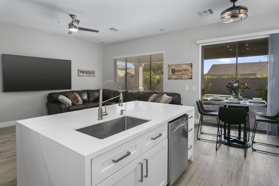 Gorgeous center island with quartz waterfall on both sides