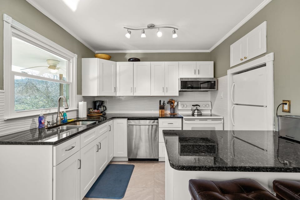 Kitchen area  fully equipt with bar area seating for 2