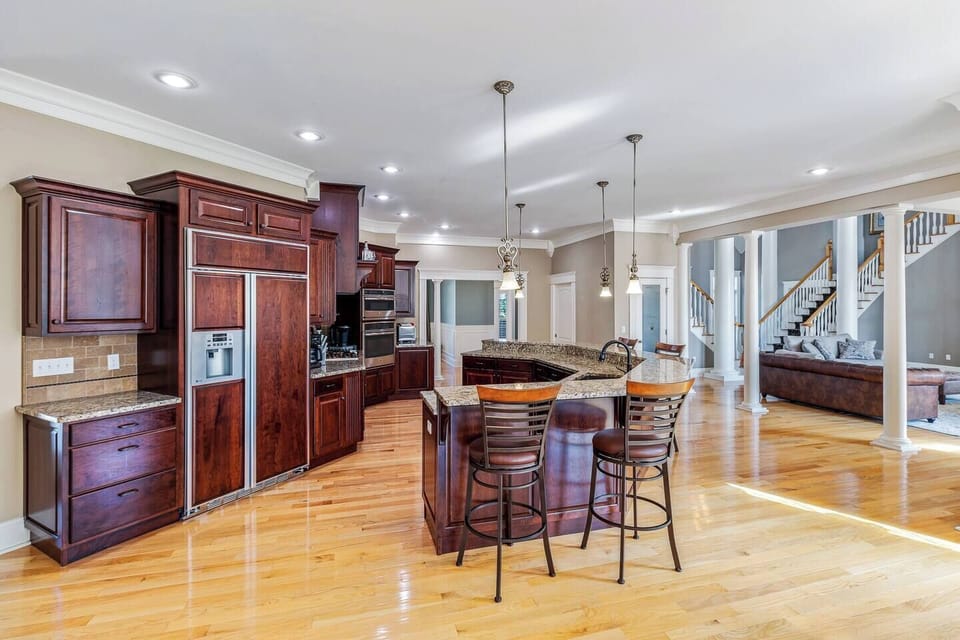 Full kitchen with refrigerator, dishwasher, microwave, propane stove, and oven