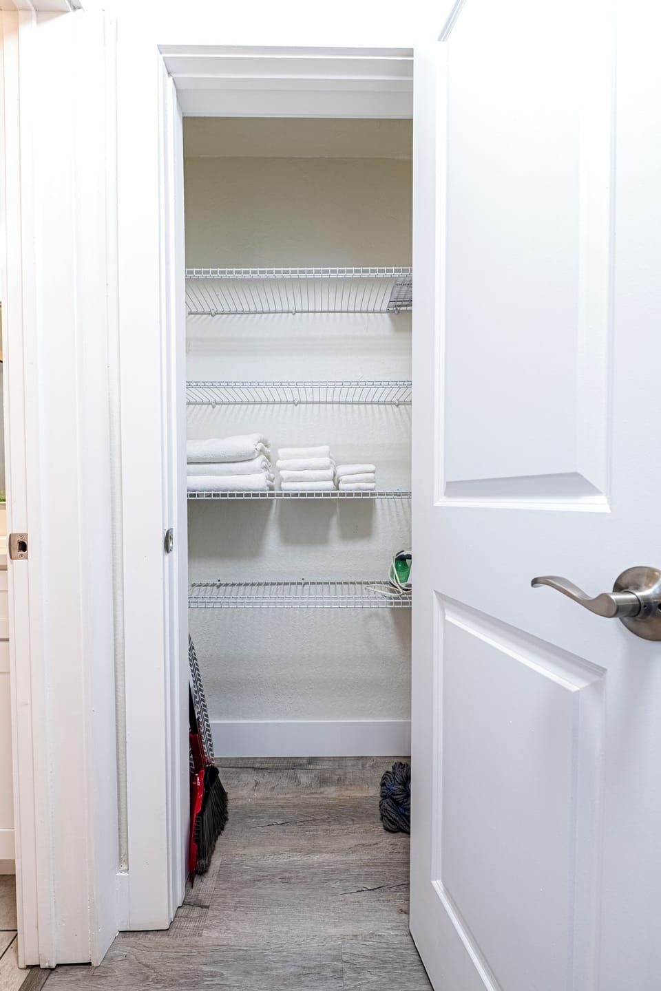 Large Linen Closet with Iron and Extra Sheets and Towels
