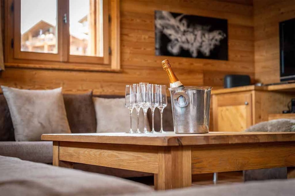 Enjoy a glass of wine while relaxing on the couch.
