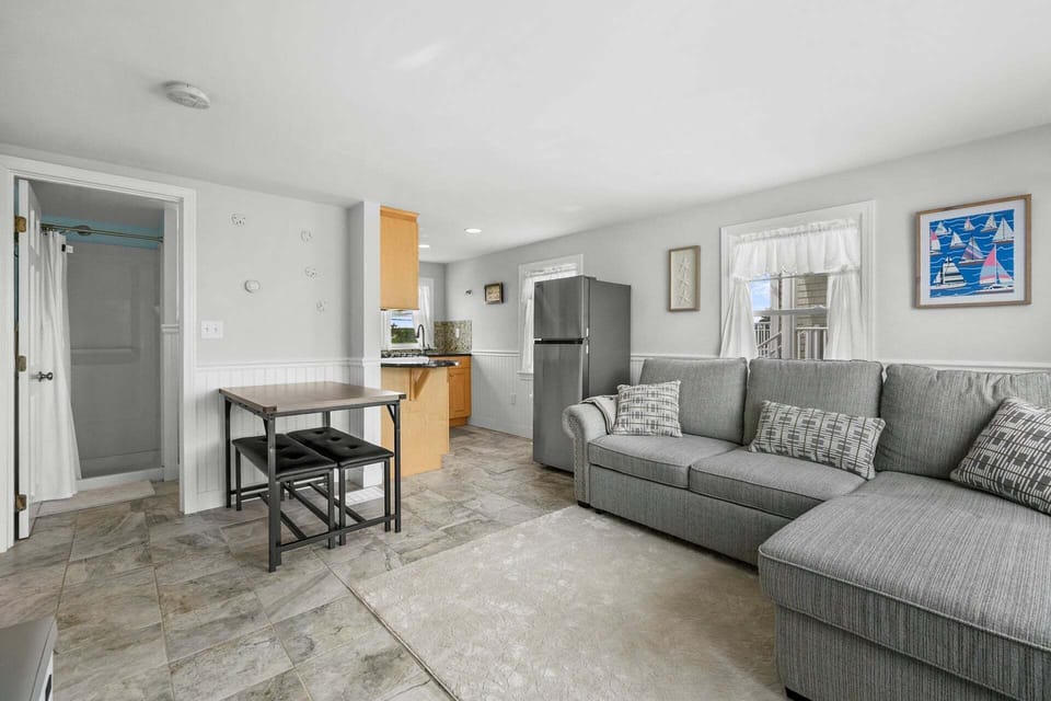 Open concept dining area and living room looking into the kitchen