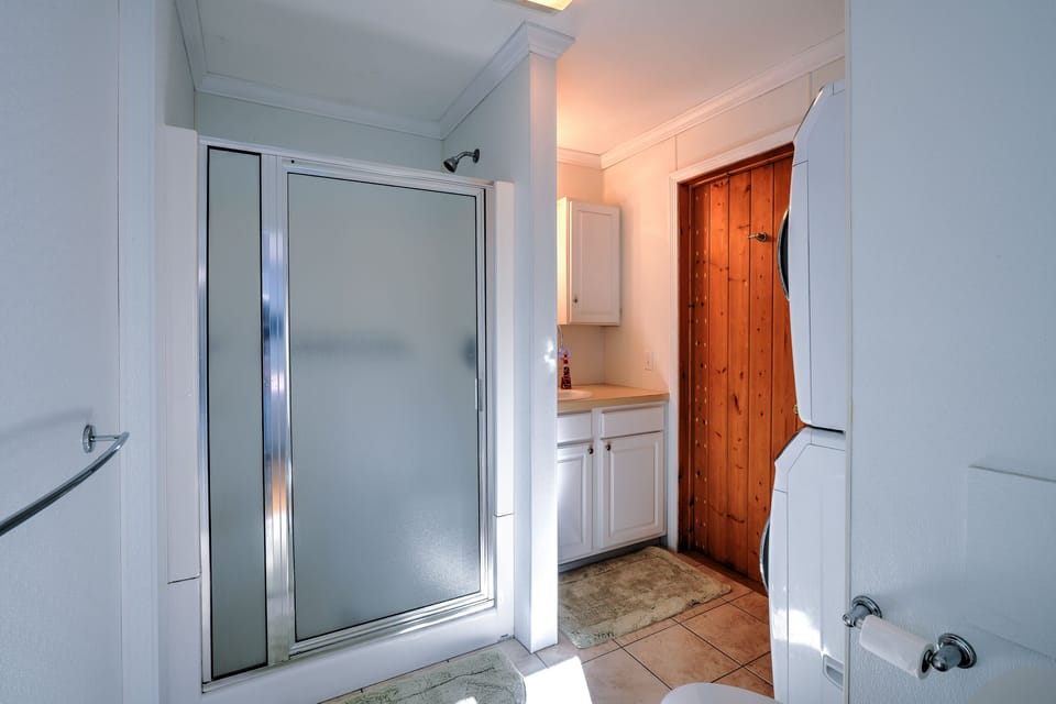 Full Bathroom #1 with a stand up glass door shower.