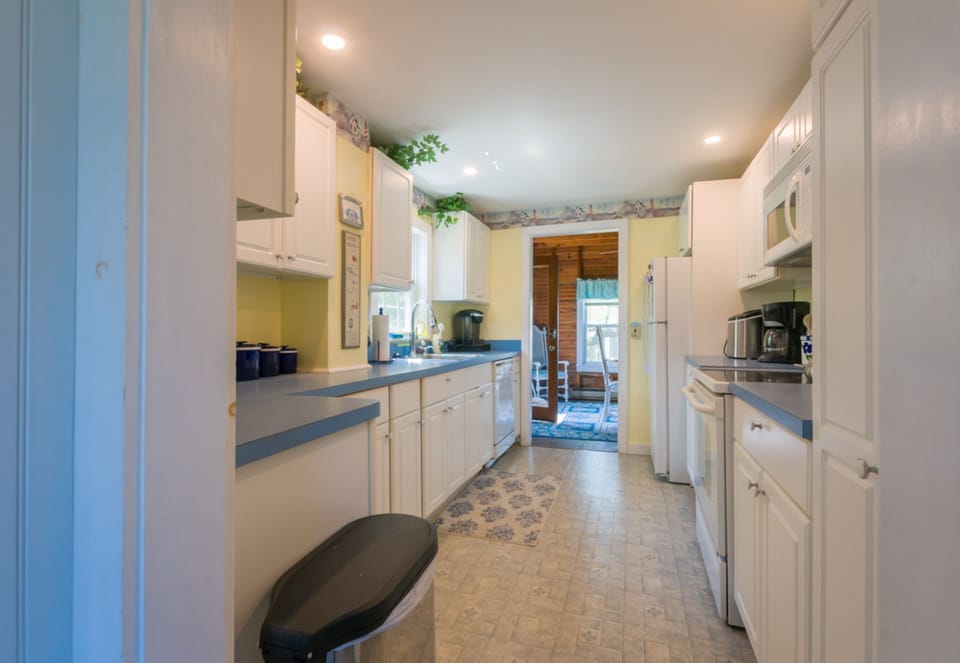 Galley kitchen with all appliances.