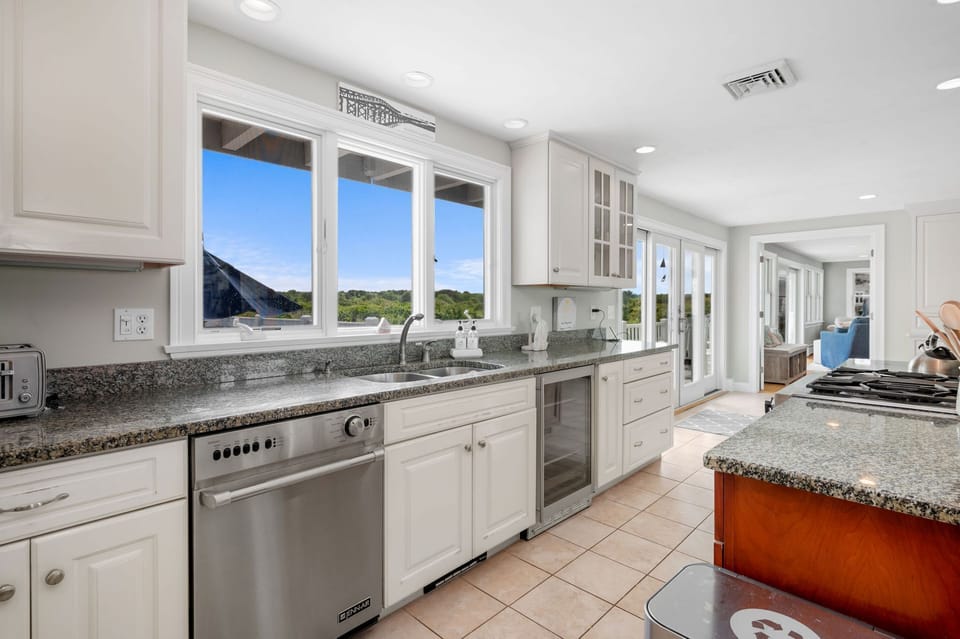 Kitchen sink with pool views